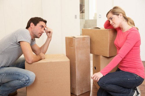 Local moving van loading household furniture and boxes in Eastcote