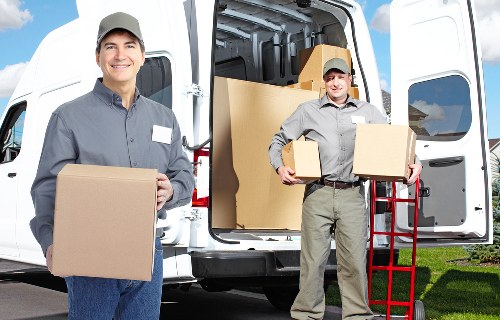 Packed household boxes and furniture ready for transport